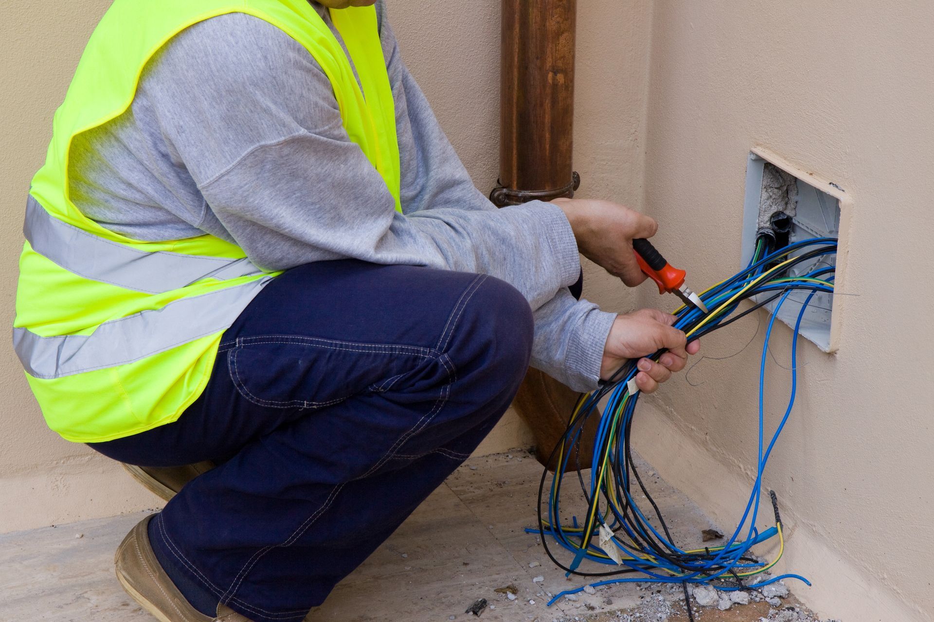 Worker Working on Electrical Wiring — Westborough, MA — Marty's Electric Co
