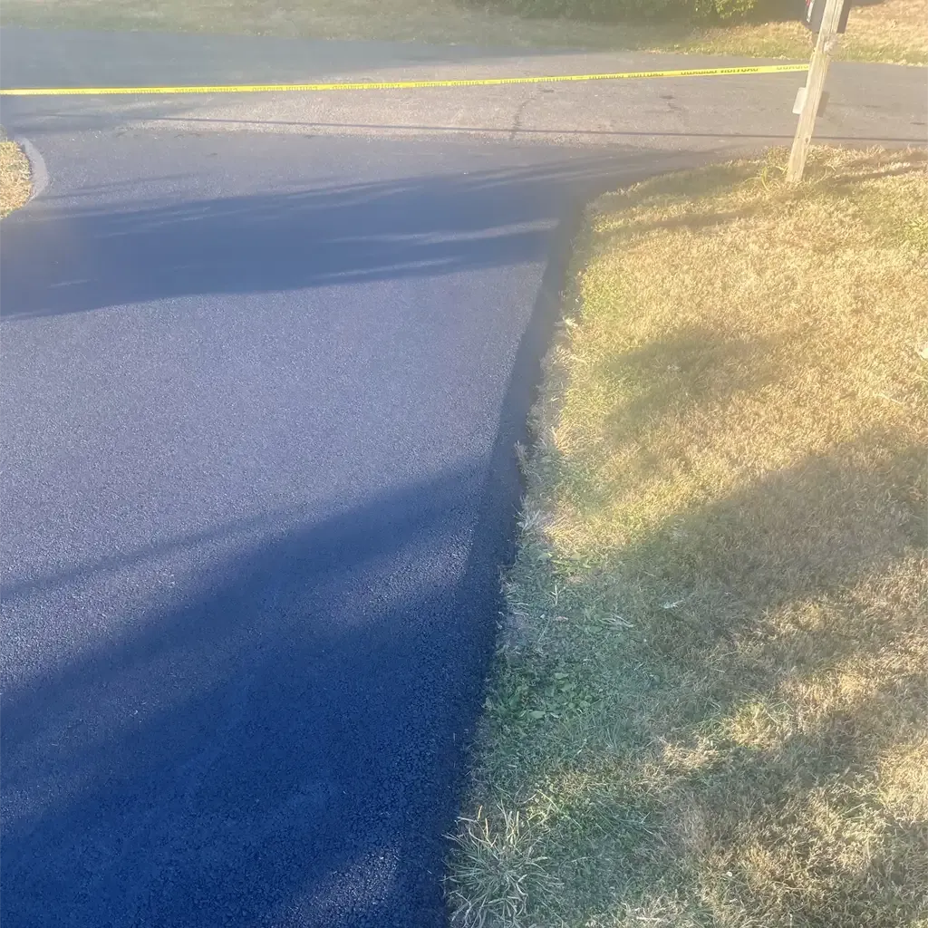 High-quality asphalt driveway paving by Allstate Paving of PA across Downingtown, Villanova, and West Chester neighborhoods.
