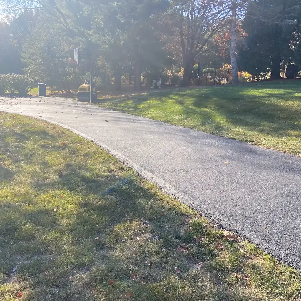 Smooth asphalt driveway surface paved by Allstate Paving of PA for homeowners in Downingtown, Villanova, and West Chester.