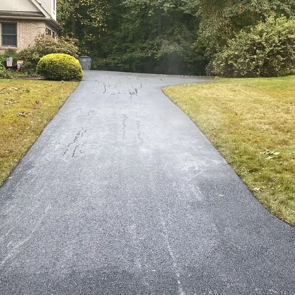 Driveway paving project by Allstate Paving of PA showcasing asphalt installation in Downingtown, Villanova, and West Chester.