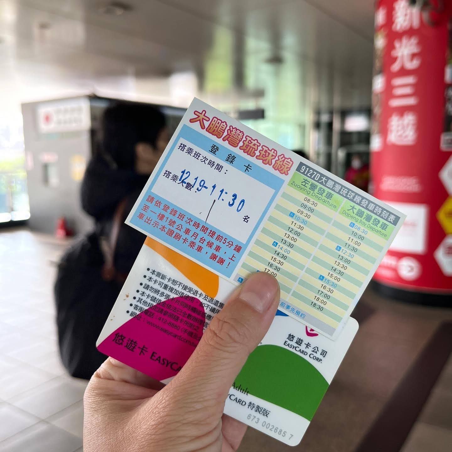 A person holding a ticket that says 11:38 on it