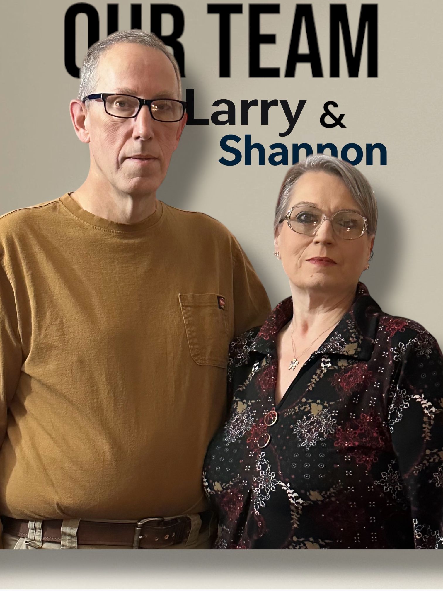 A man and a woman are standing next to each other in front of a sign that says our team