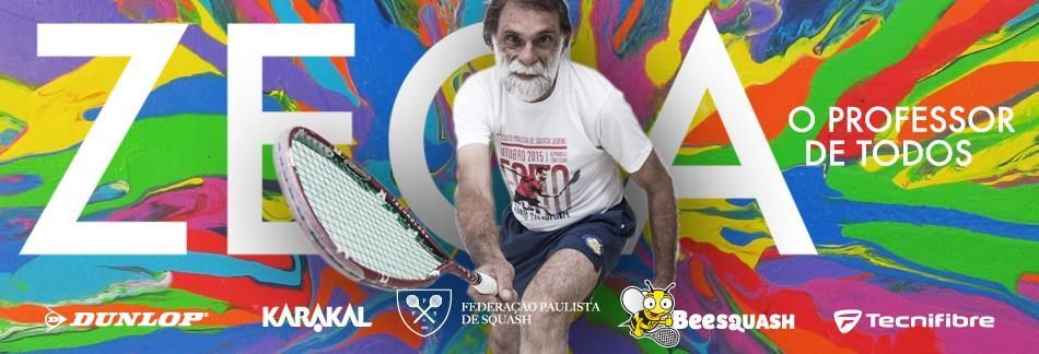 Um homem está segurando uma raquete de tênis em frente a um fundo colorido.