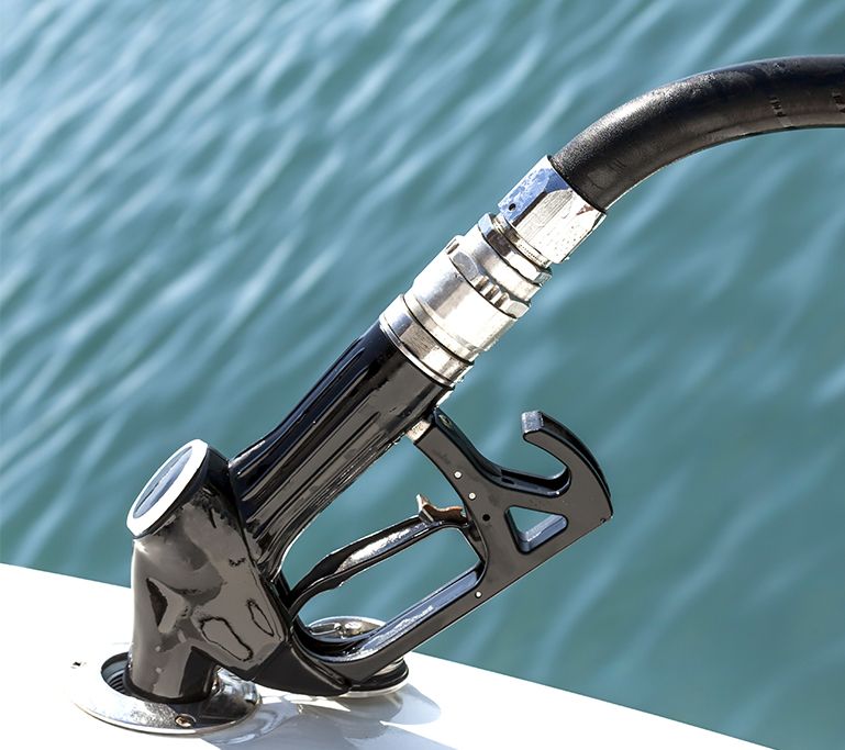 A close up of a gas pump on a boat