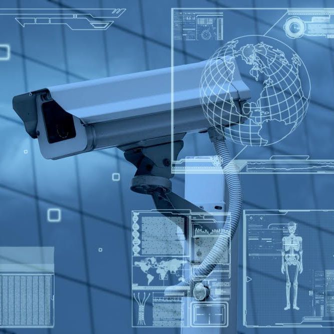 A security camera with a globe in the background