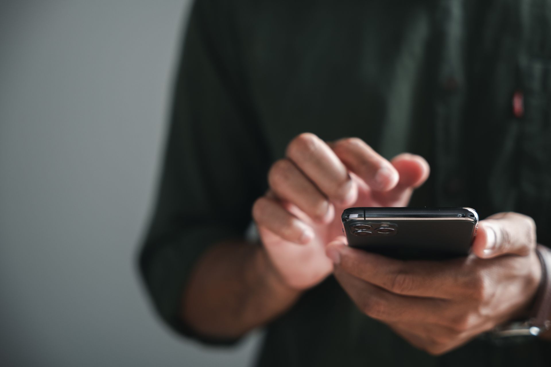 A man looking at his cellphone