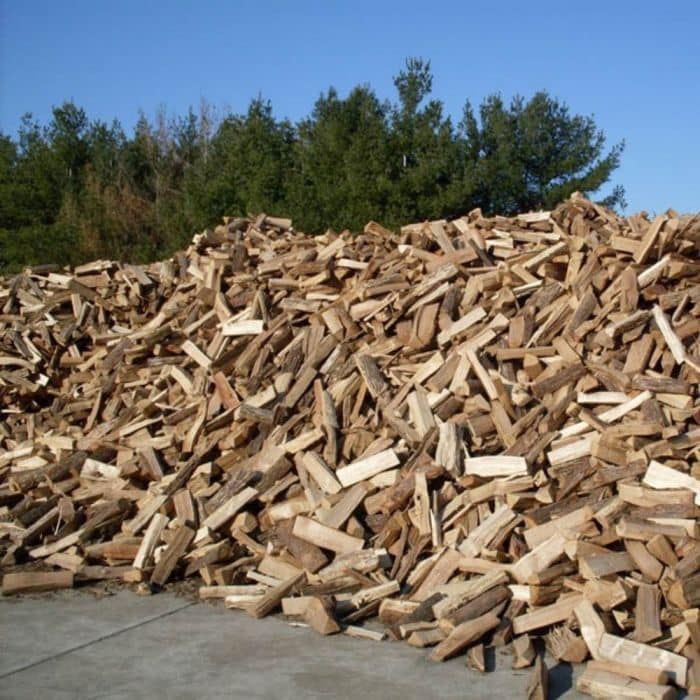 A large pile of wood is sitting on the ground