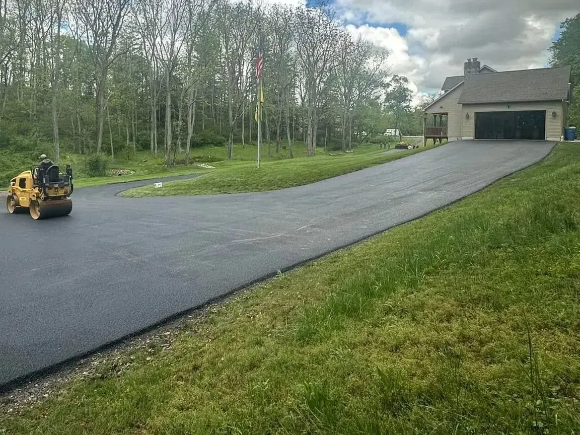 Durable asphalt driveway completed by CM Ayres, designed to handle Maryland’s changing seasons.