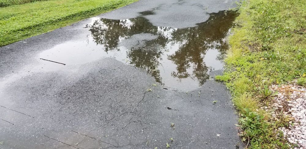 Pooling Water on Driveway - Asphalt Paving Company in Baltimore, MD - Job done by CM Ayres Enterprises