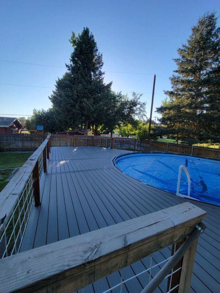 a deck with a circular pool inside it in Kennewick