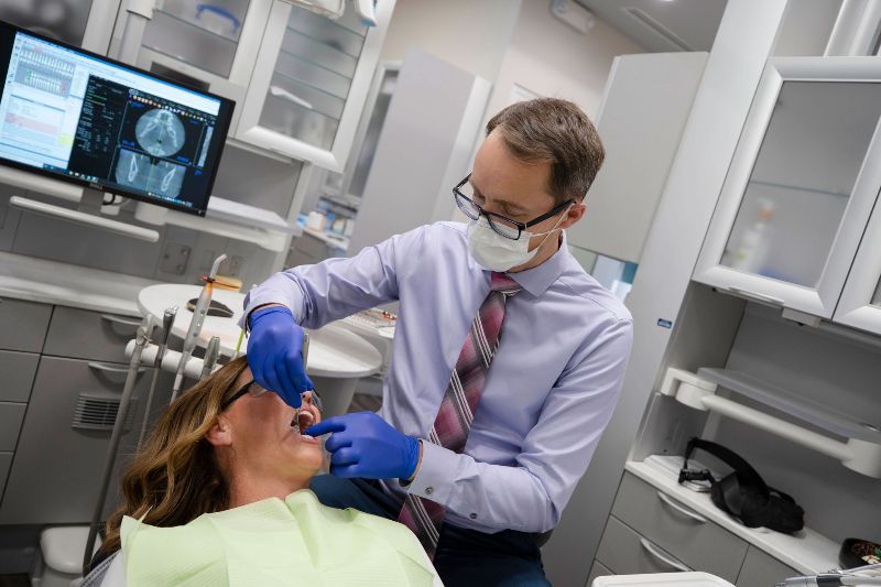 Dr. Alex Matheson performing an emergency dental exam at Bellissimo Dentistry in Chandler AZ