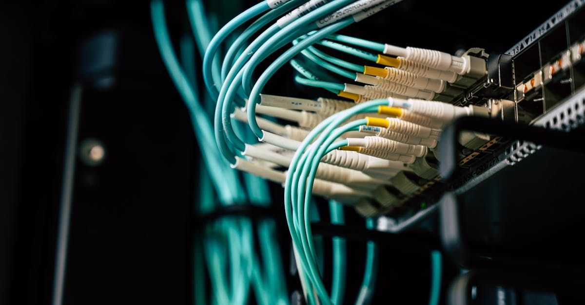 A bunch of wires are connected to a server in a data center.
