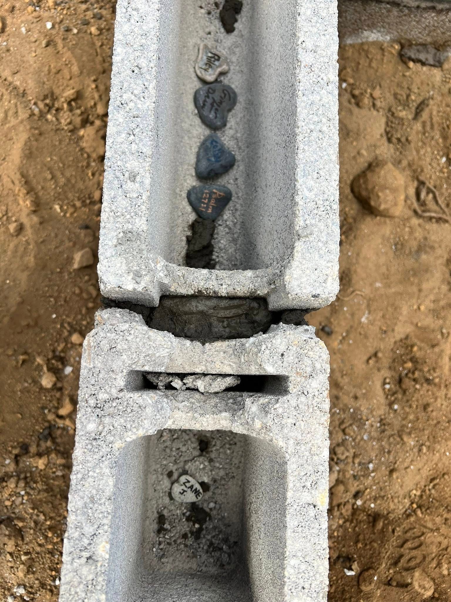 Heart Stone Dinner stones sit in the hollow center of a foundation cindeblock.