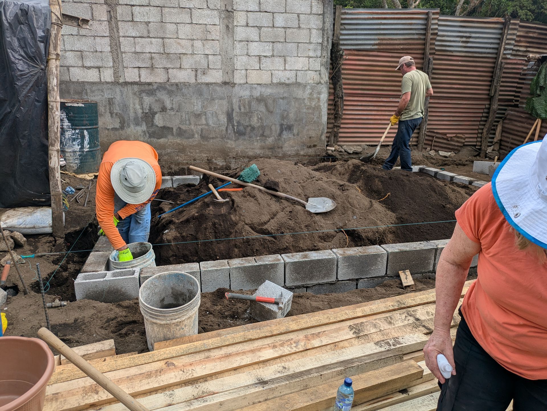 A group of people are working on a construction site.