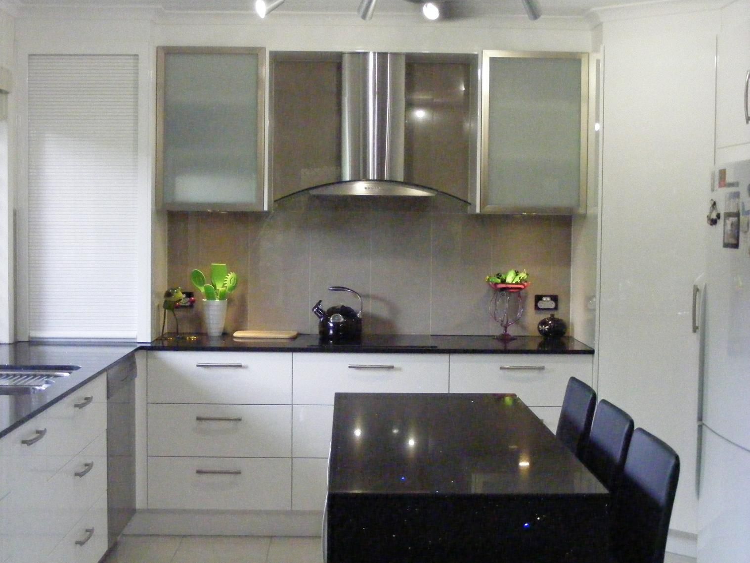Kitchen With White Cabinets and Black Counter Tops — Advance Kitchens in Caloundra, QLD