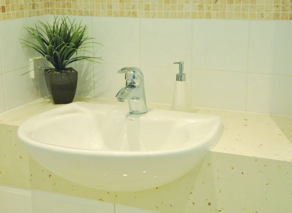 Bathroom Sink With a Plant in a Pot Next to It — Advance Kitchens in Beerwah, QLD