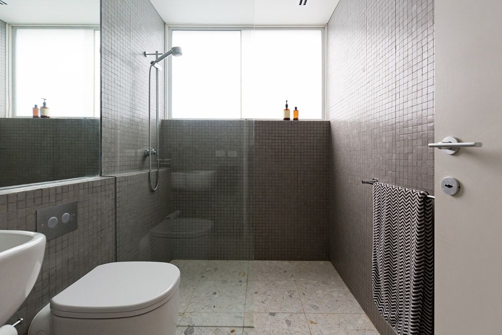 A Bathroom With a Toilet, Sink, and Walk in Shower — Maestro Tiling Services In Murrumbateman, NSW