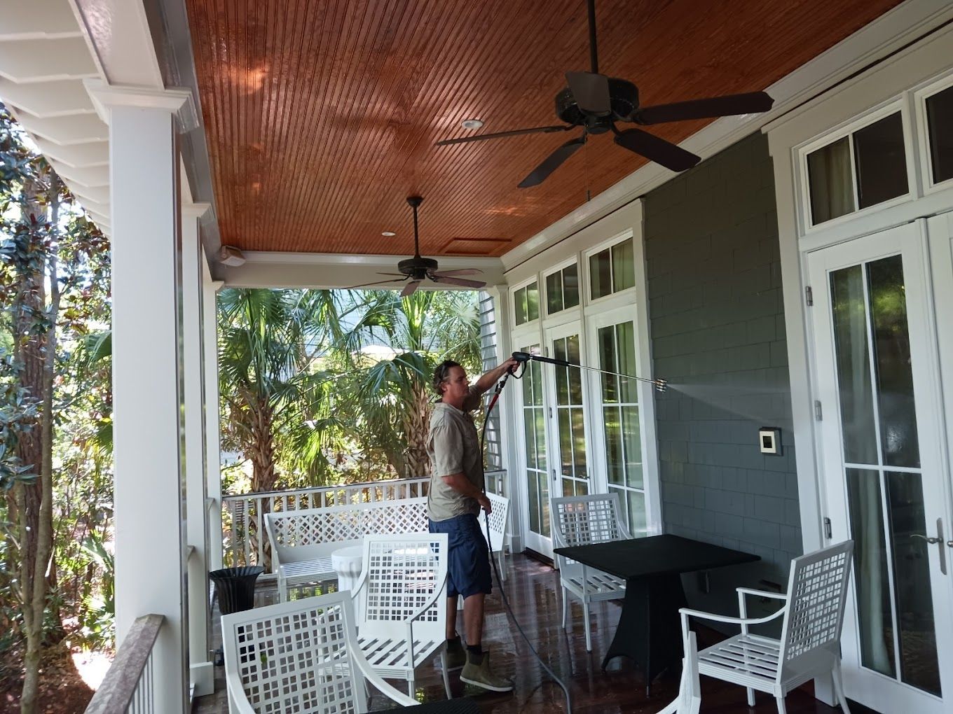 A large house with a white garage door and a balcony