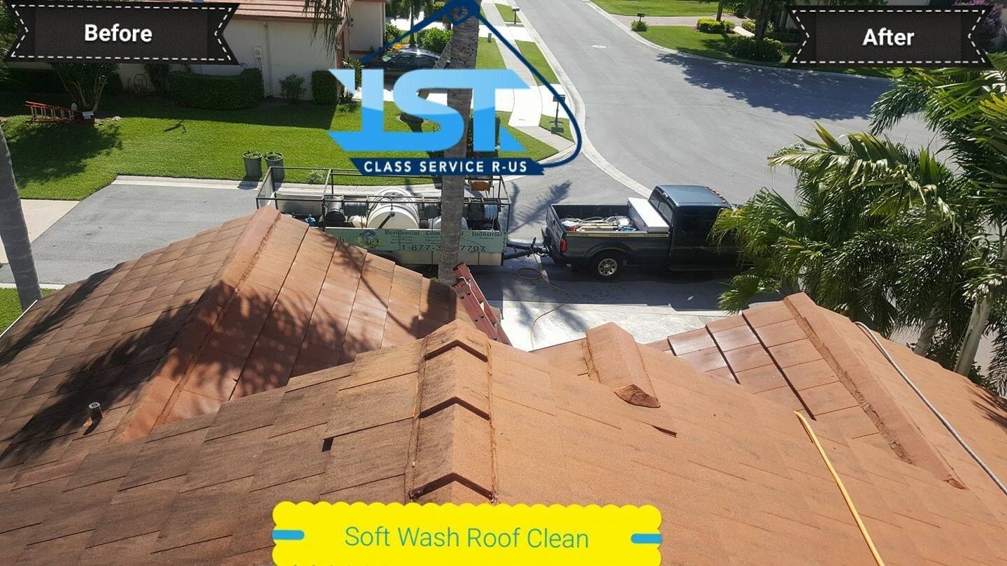 An aerial view of a roof being cleaned by yst