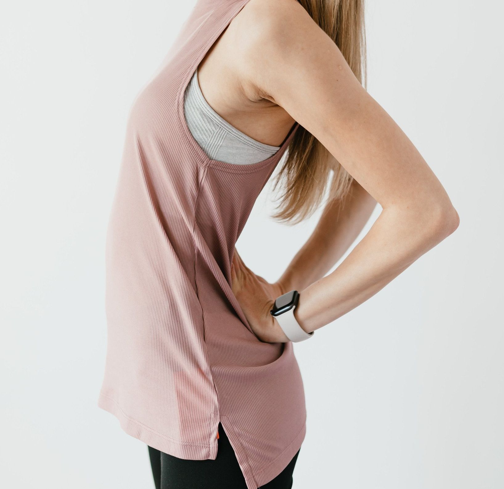 Person arching a flexible lower back after receiving a chiropractic adjustment
