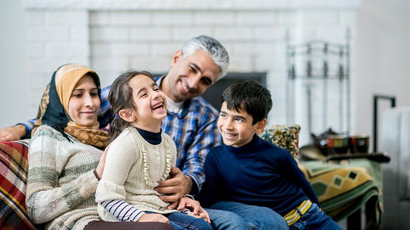 Family hanging out on the couch