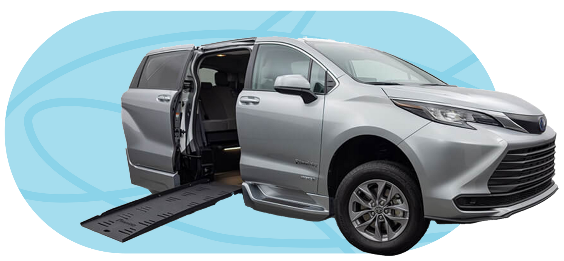 Silver minivan with a ramp extending from the side door, against a blue background.