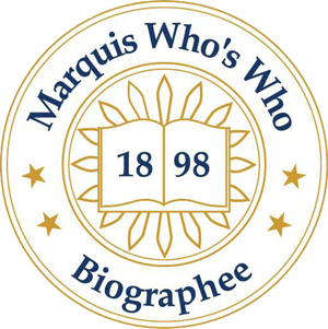 Marquis Who's Who Biographee seal: blue text on gold, open book, year 1898, surrounded by stars and a sunburst.