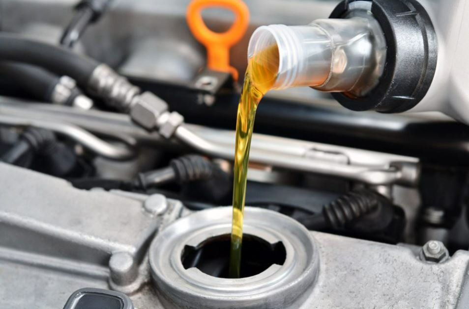 Refuel And Pouring Oil Into The Car Engine — NRMA Nambucca Riverside Motors In Nambucca Heads NSW