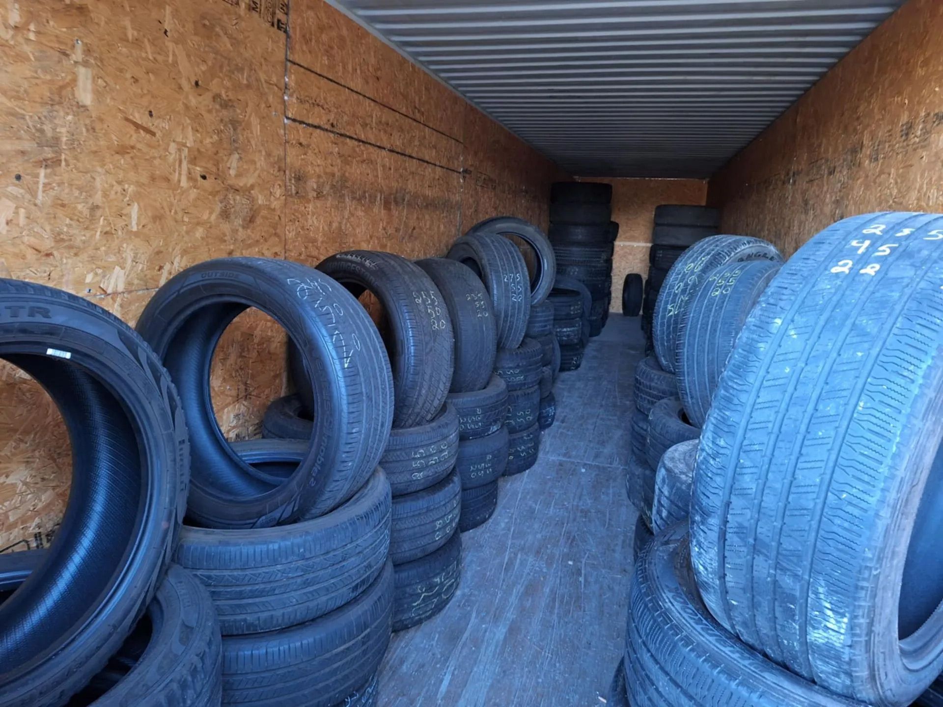 A room filled with lots of tires stacked on top of each other