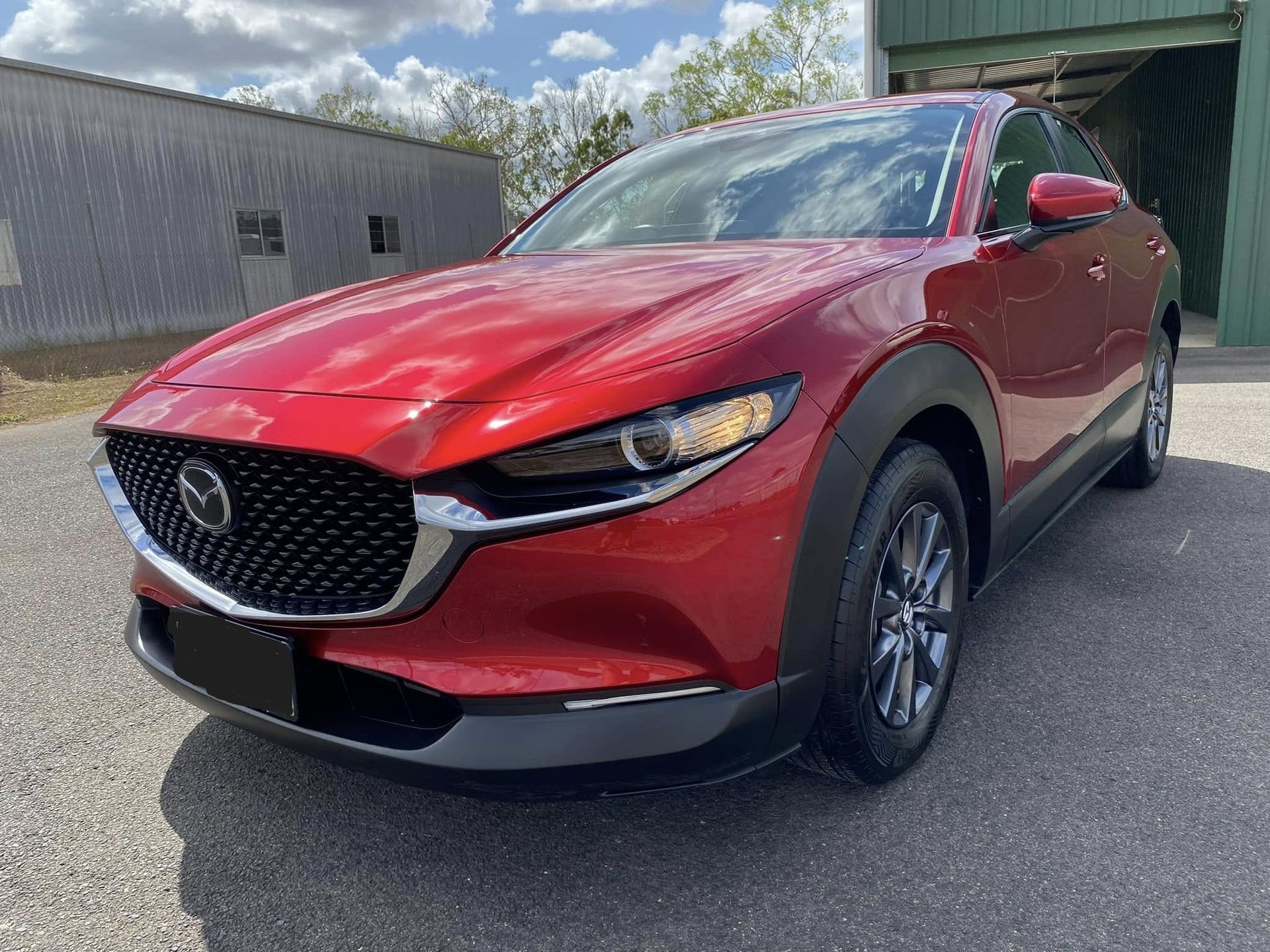 Red Mazda Cx-30 Compact Suv Parked on Asphalt, Front View — Beclean Auto Detailing in Mareeba, QLD