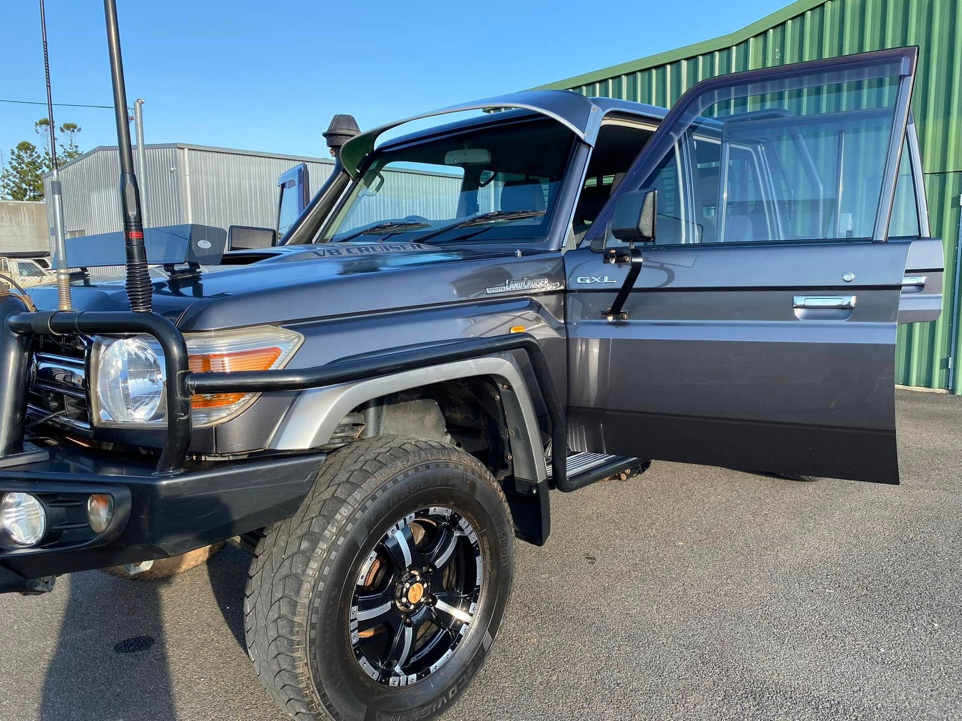 Gray Toyota Land Cruiser, Off-road Vehicle With the Driver's Door Open — Beclean Auto Detailing in Mareeba, QLD
