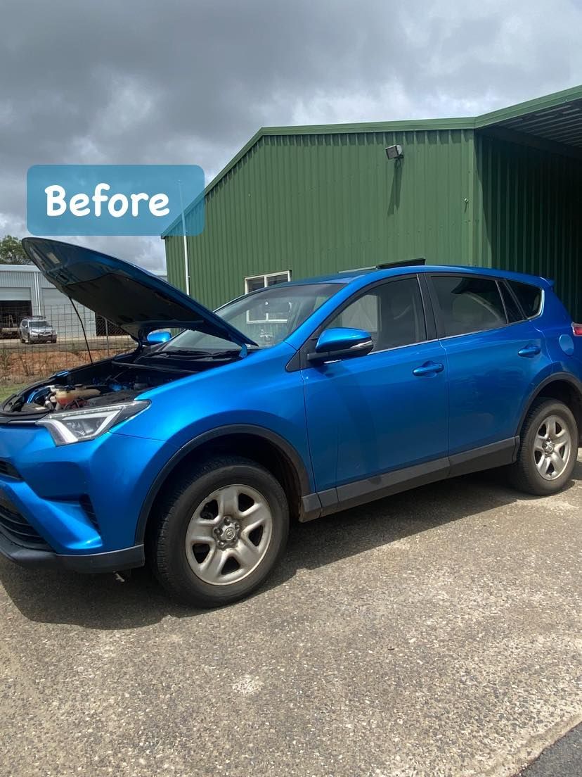 Blue SUV with hood open in front of a green building, labeled “Before” — Beclean Auto Detailing in Mareeba, QLD