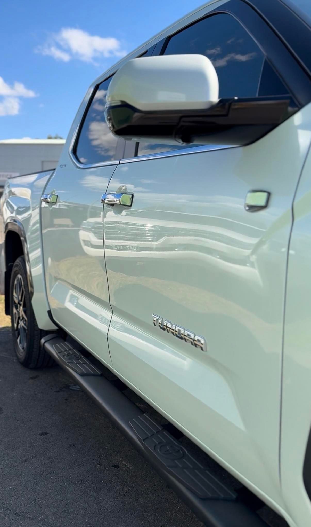 White pickup truck parked outdoors under a blue sky, side view close-up — Beclean Auto Detailing in Mareeba, QLD