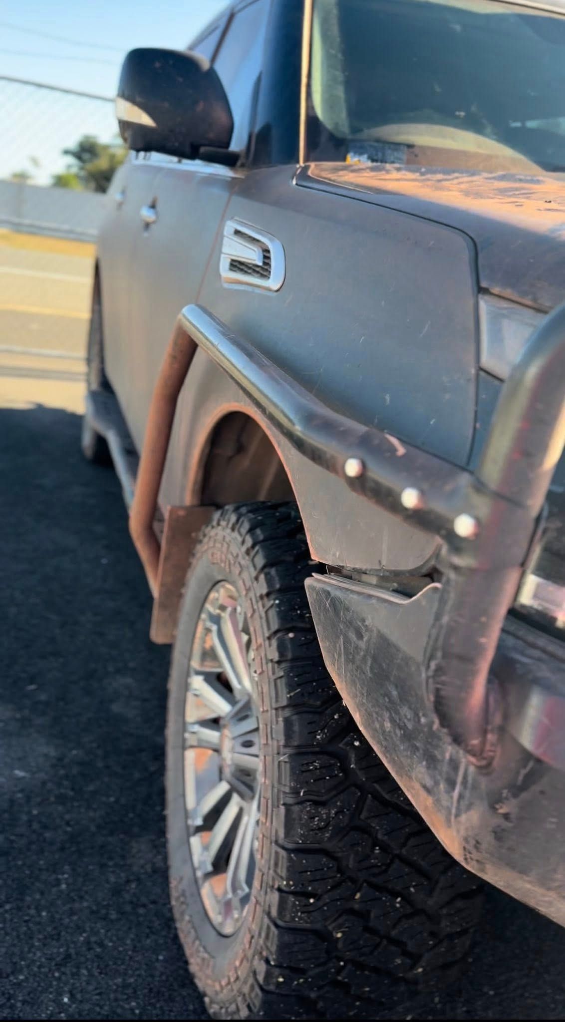 Rugged, dirty, brown SUV with black brush guard and a tire showing — Beclean Auto Detailing in Mareeba, QLD