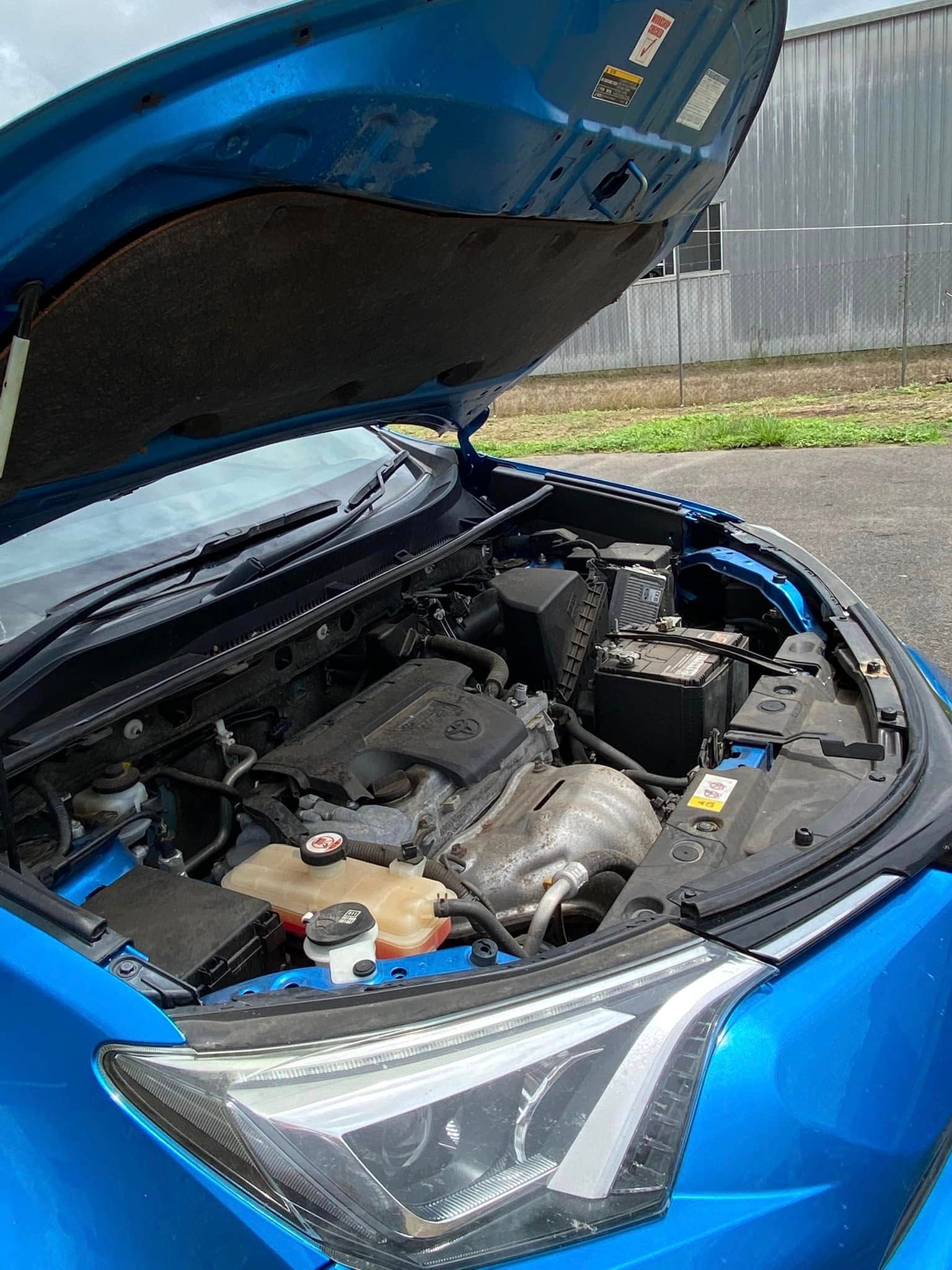 Blue car with hood open, showing engine bay and front headlight — Beclean Auto Detailing in Mareeba, QLD