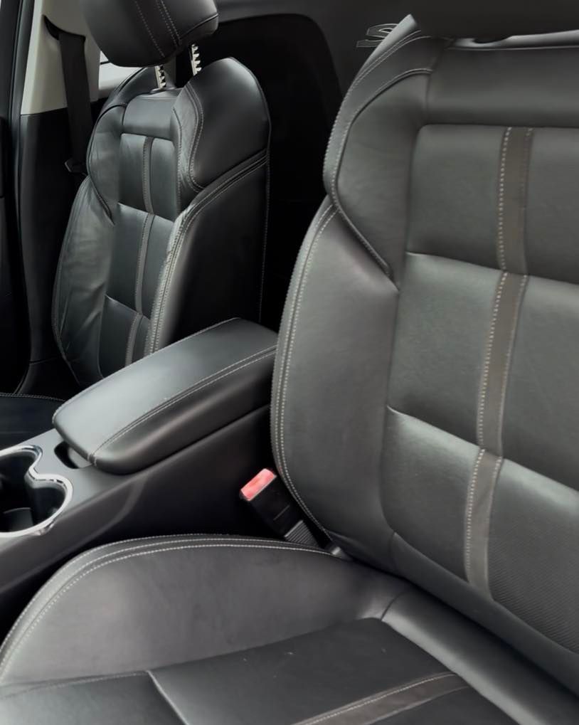 Black leather car seats with white stitching and center console in a vehicle interior — Beclean Auto Detailing in Mareeba, QLD