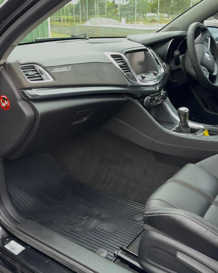 Car Interior with Black Leather Seats, Dashboard, and Manual Gear Shift — Beclean Auto Detailing in Mareeba, QLD