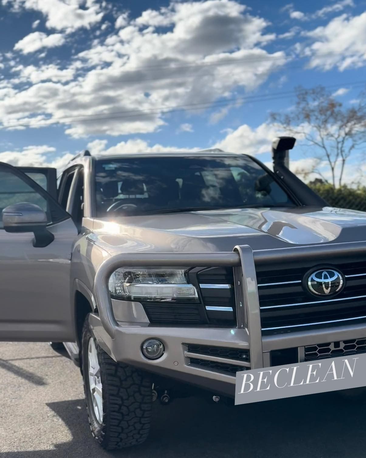 Tan Toyota Land Cruiser With Bull Bar and Snorkel Parked Outdoors — Beclean Auto Detailing in Mareeba, QLD