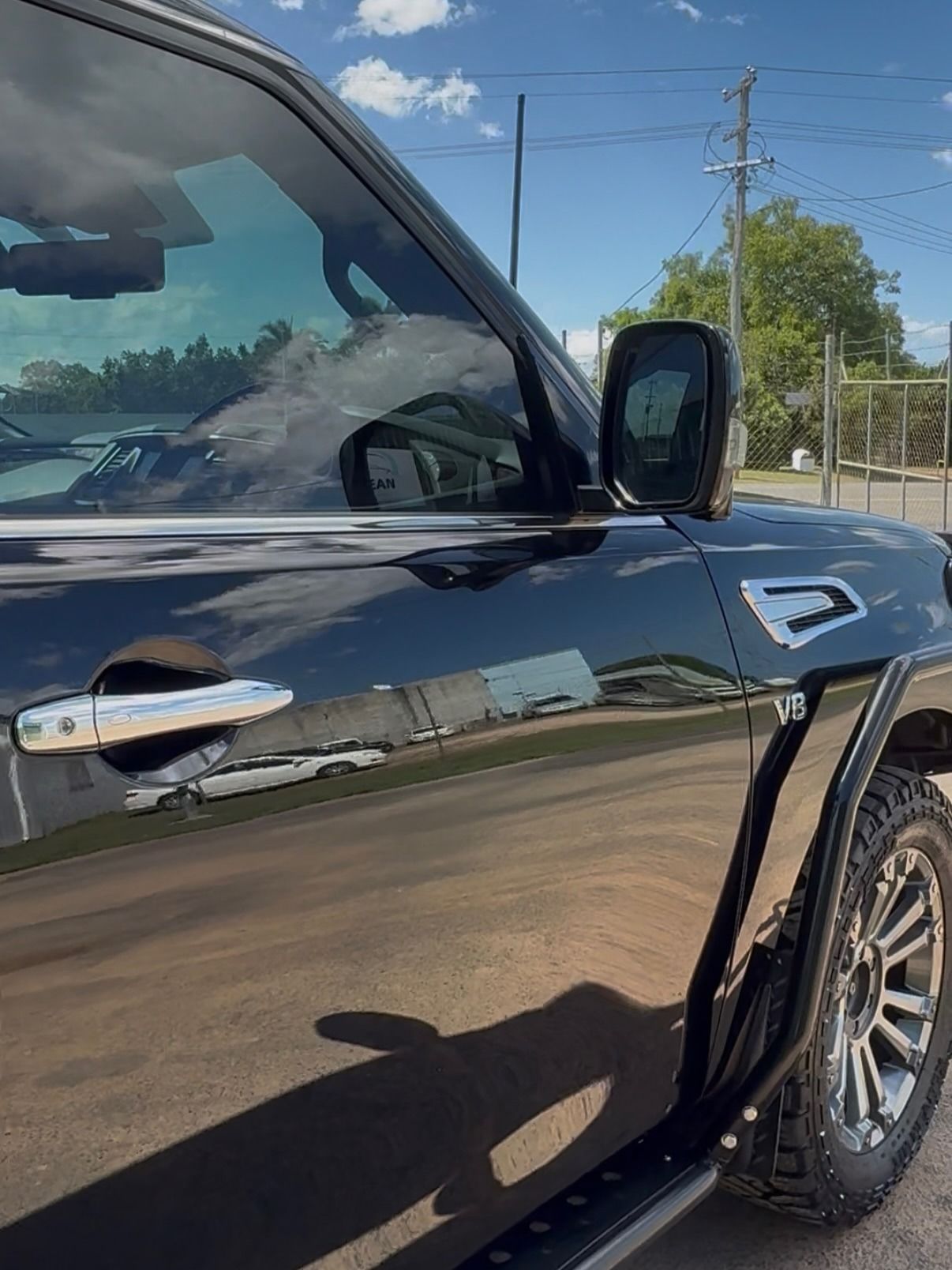 Black SUV Parked Outdoors, Shiny Paint, Chrome Door Handle, Side Mirror — Beclean Auto Detailing in Mareeba, QLD