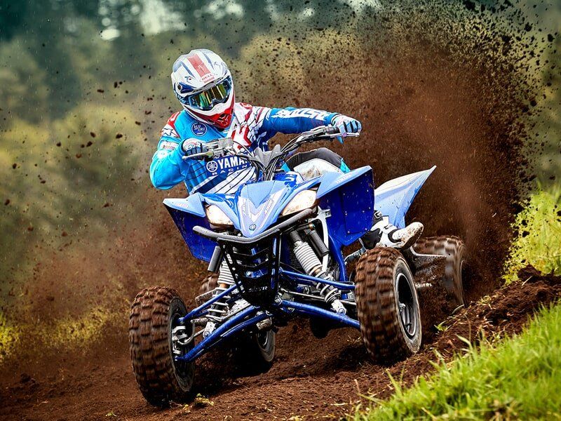 Man In Full Gear Riding An Off-Road Vehicle — Motorcycle Dealer in Berrimah, NT