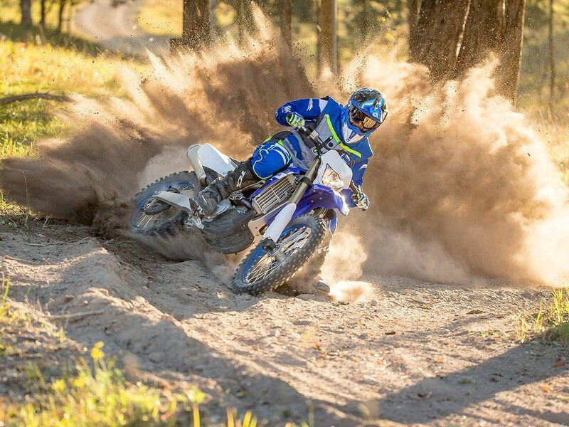 Man In Blue Riding A Motorcycle — Motorcycle Dealer in Berrimah, NT