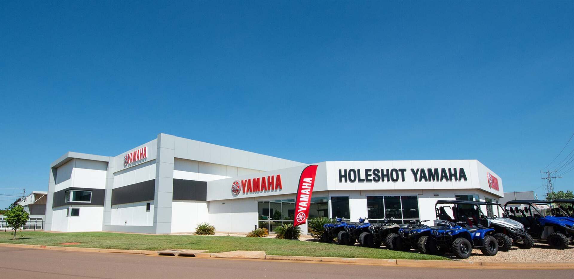 Building With Parked Off-Road Vehicles — Motorcycle Dealer in Berrimah, NT