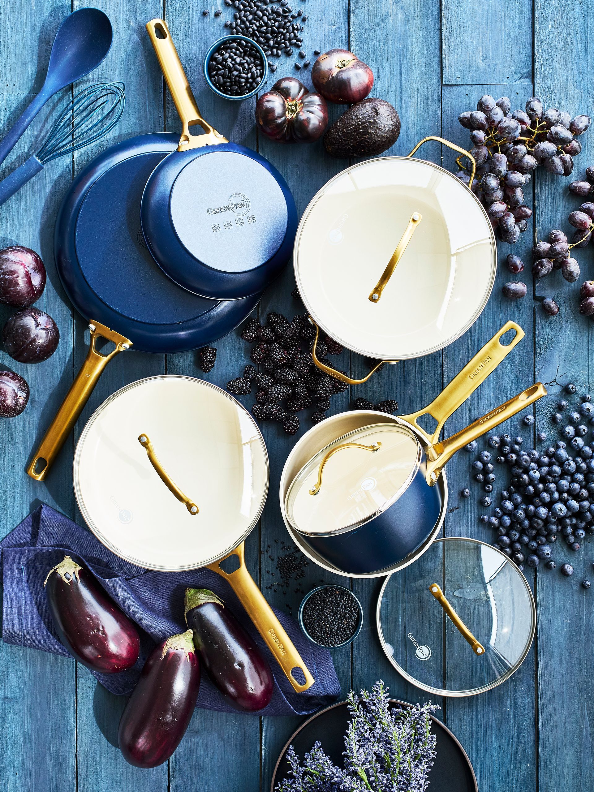 A bunch of pots and pans sitting on top of a wooden table.