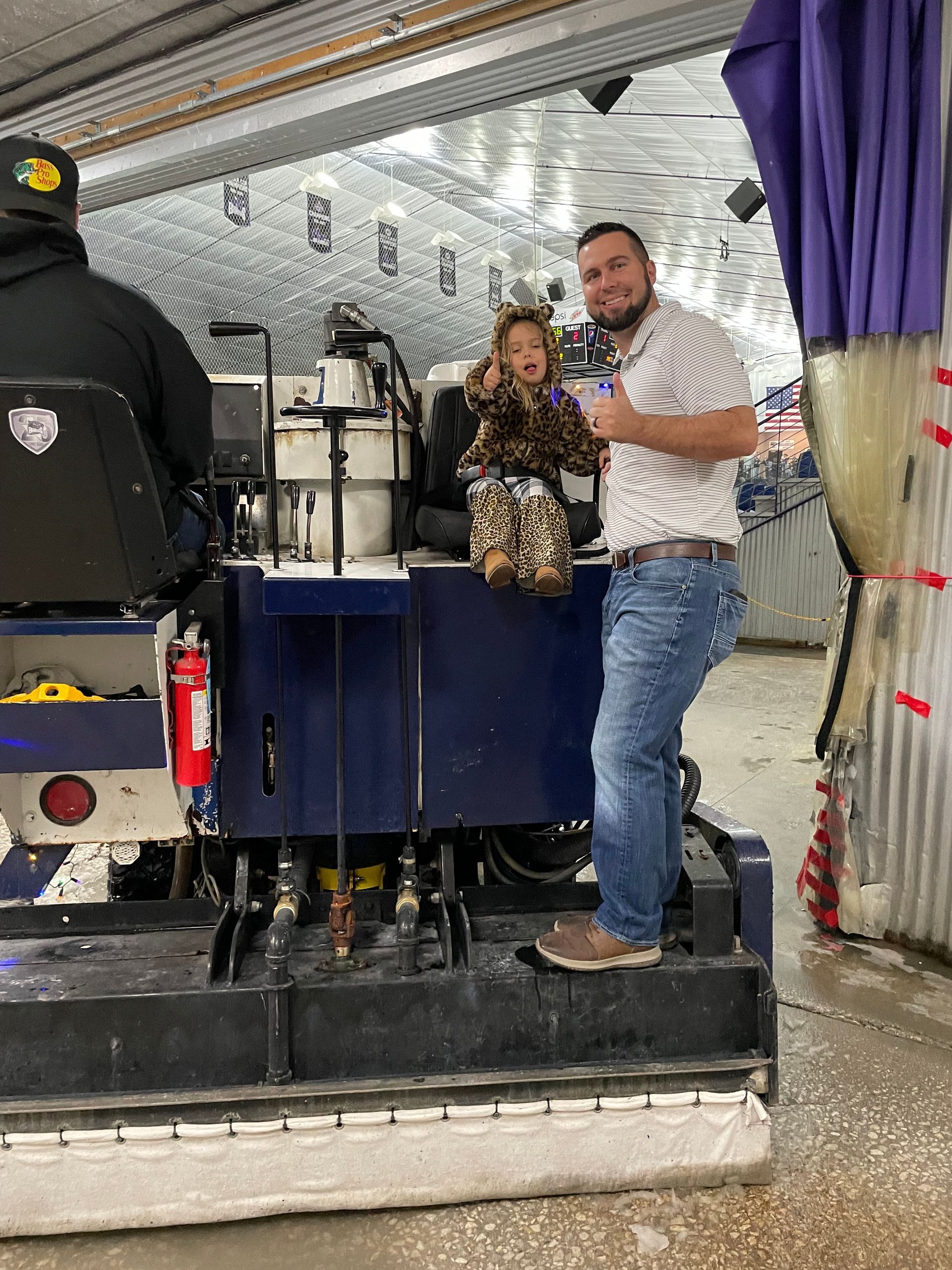 Young Girl Sitting On A Hockey Machine — Haslet, TX — Black Tie Roofing