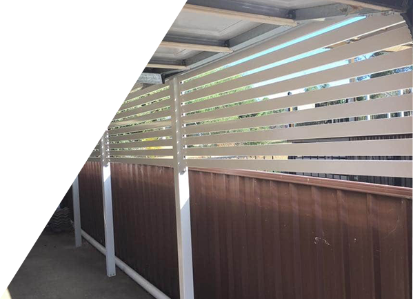 A wooden fence with white stripes on it