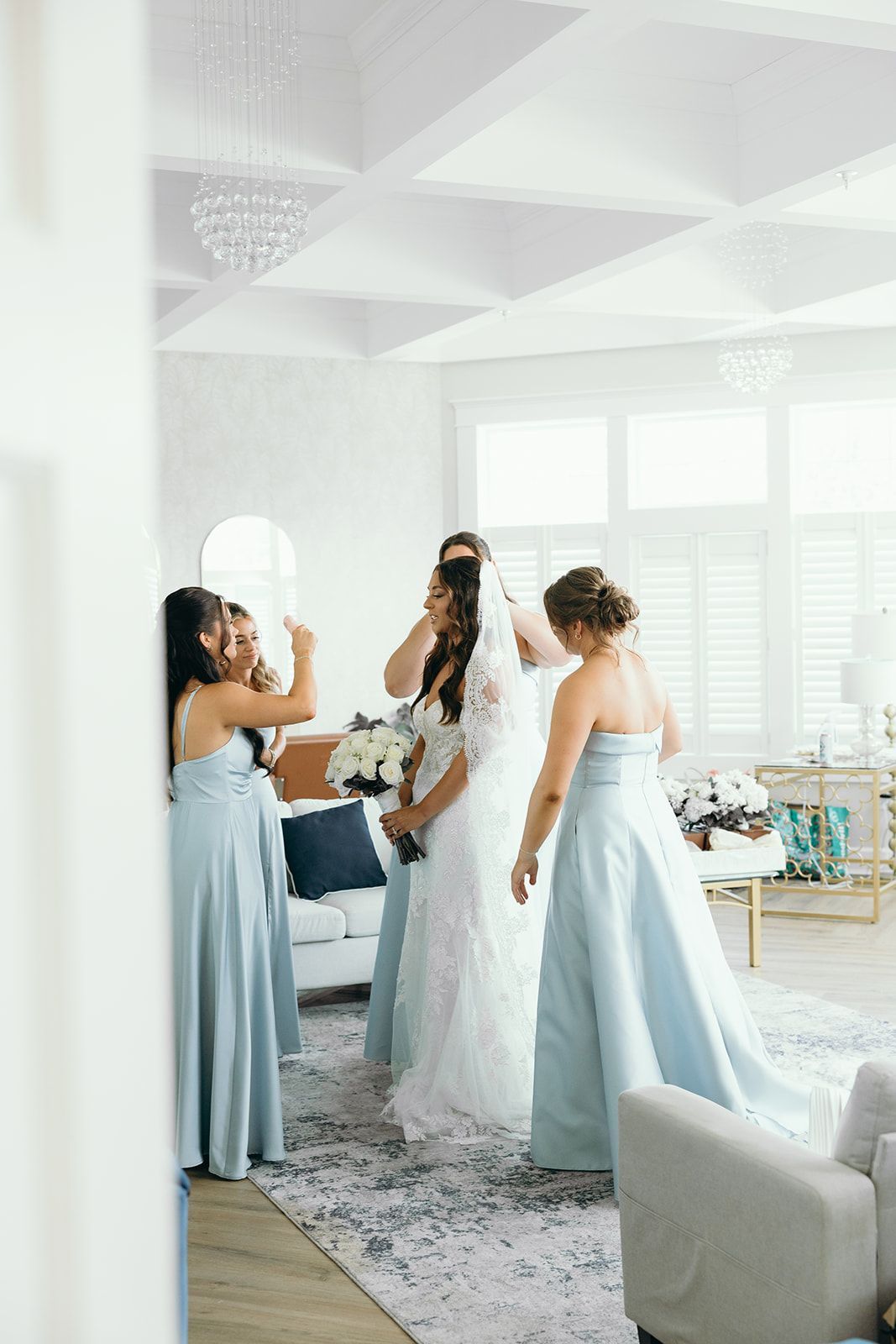 A bridal suite filled with furniture and a blue couch.