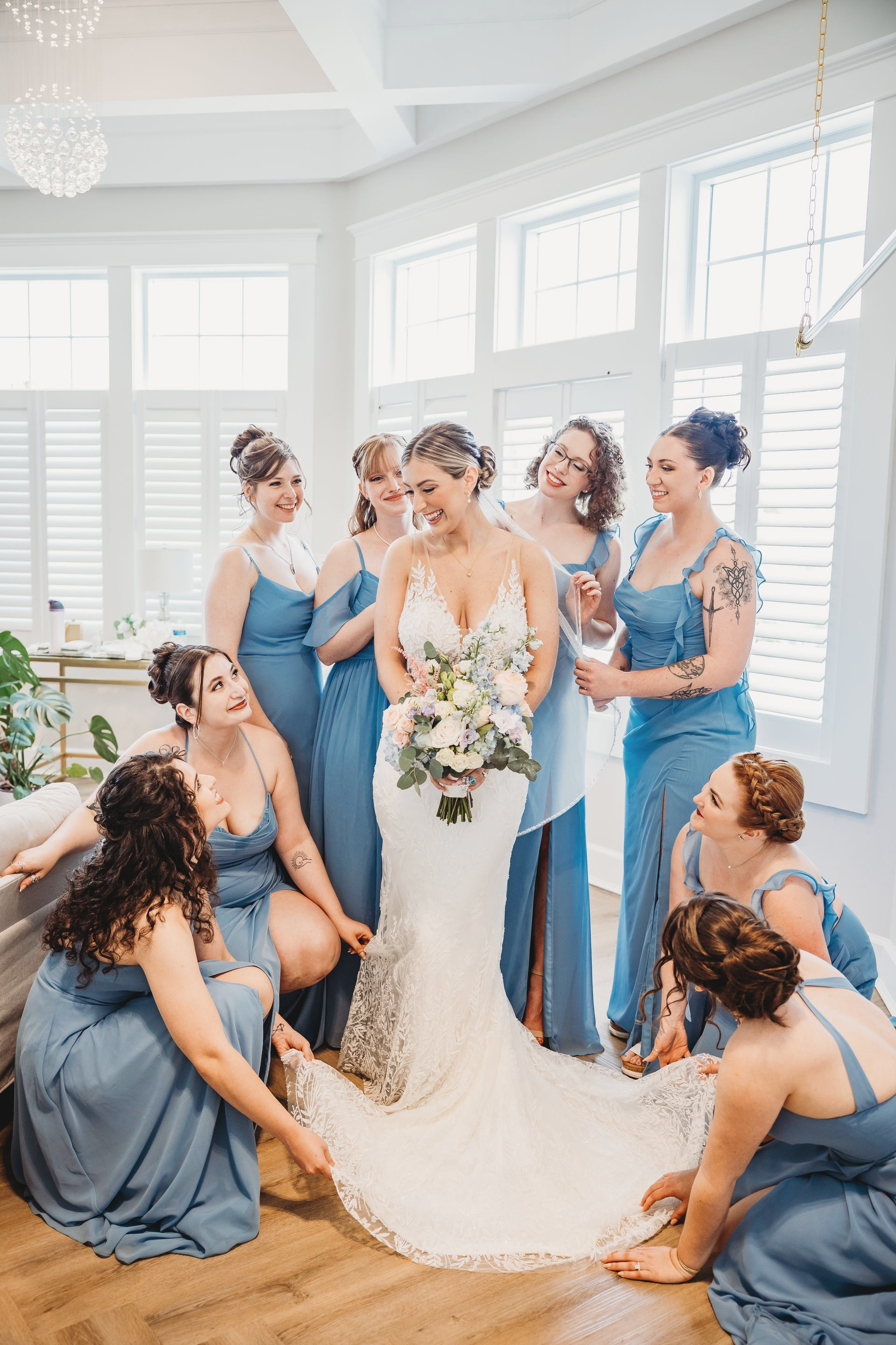 A large bridal suite filled with furniture and lots of windows.