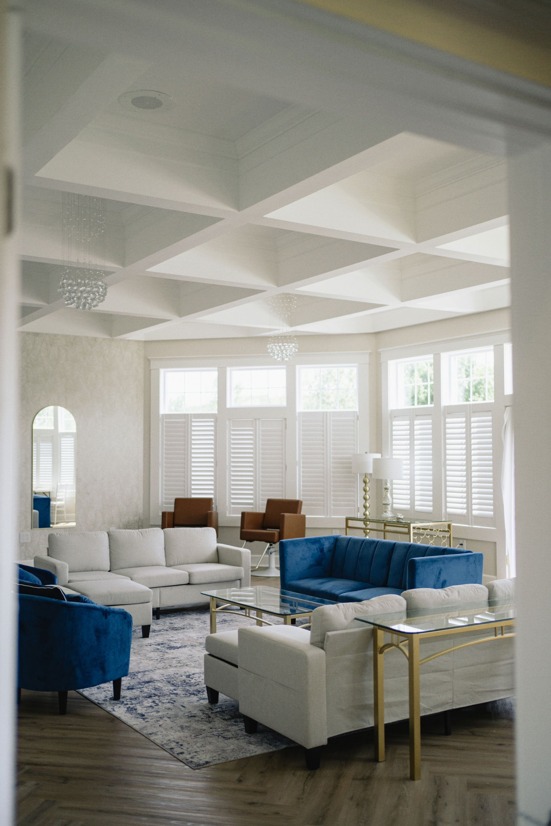 A bridal suite filled with furniture and a coffered ceiling.