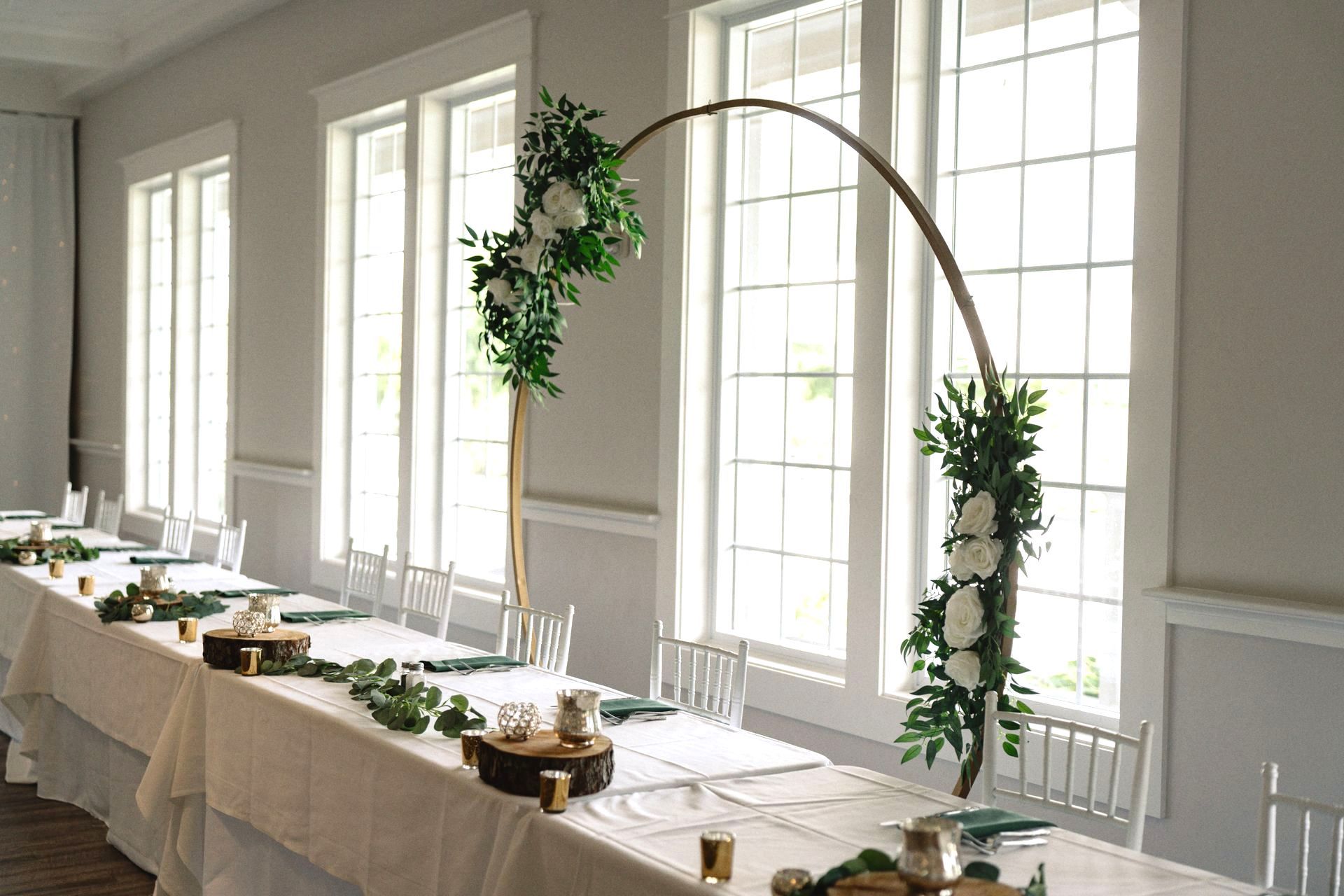 A table is decorated with flowers for a wedding.