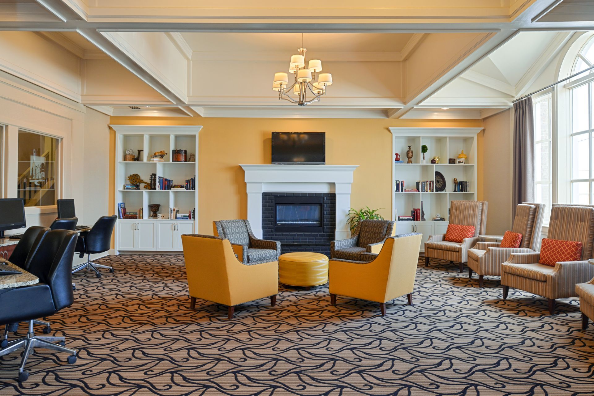 A living room filled with furniture and a fireplace.